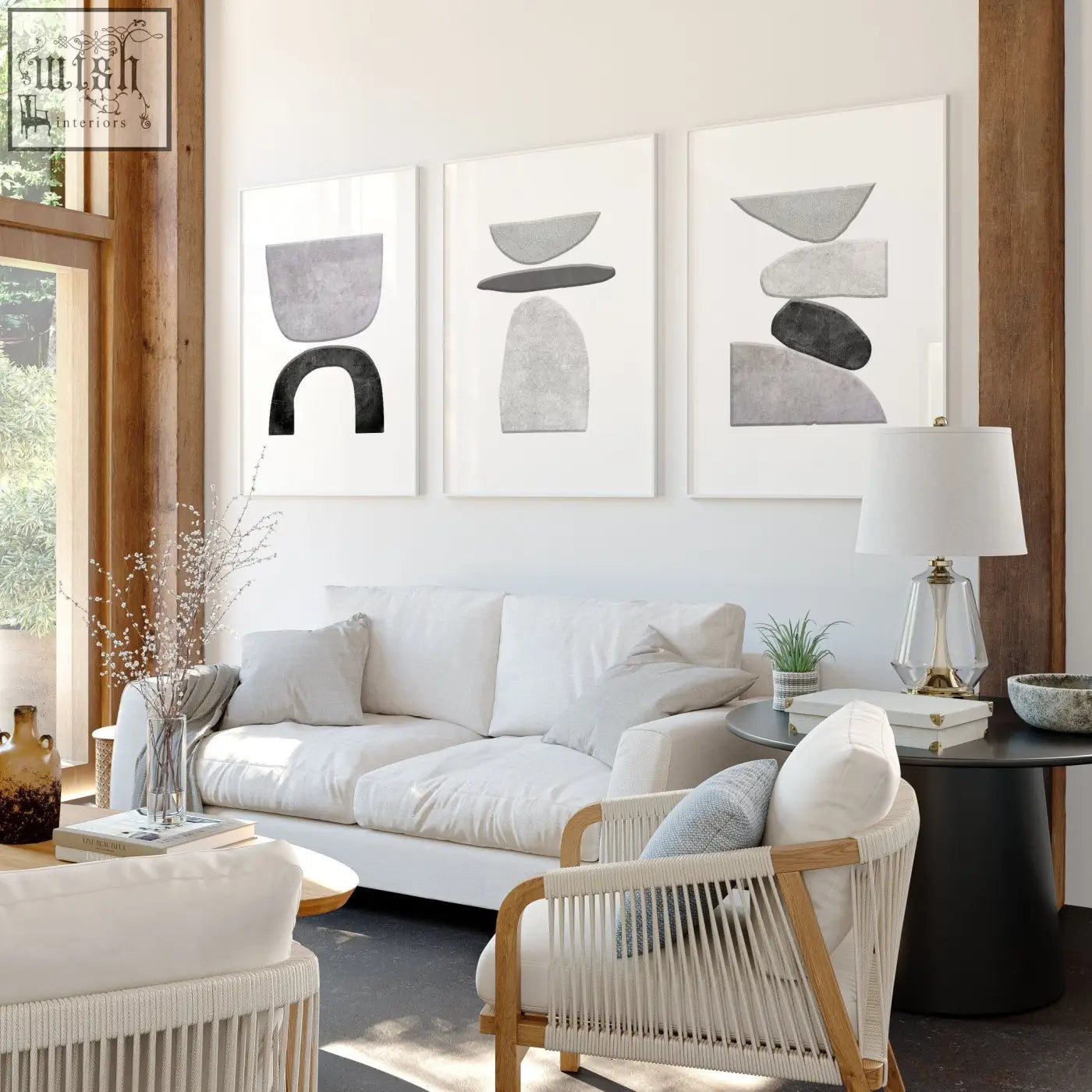 Set of 3 wall art prints featuring minimalist abstract black and white stacked stone shapes with white frames