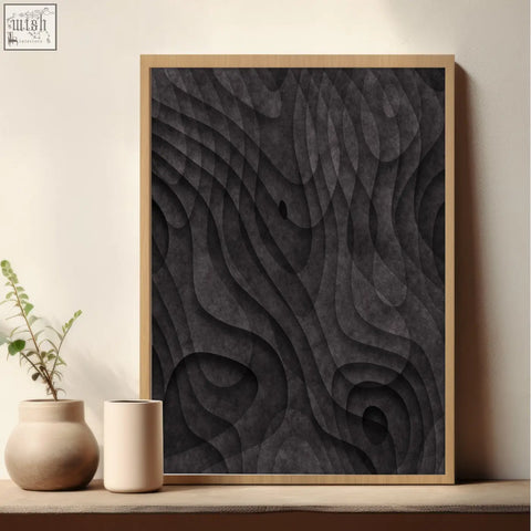 A framed abstract painting with dark charcoal topographic wave texture in a light wood frame wall art print