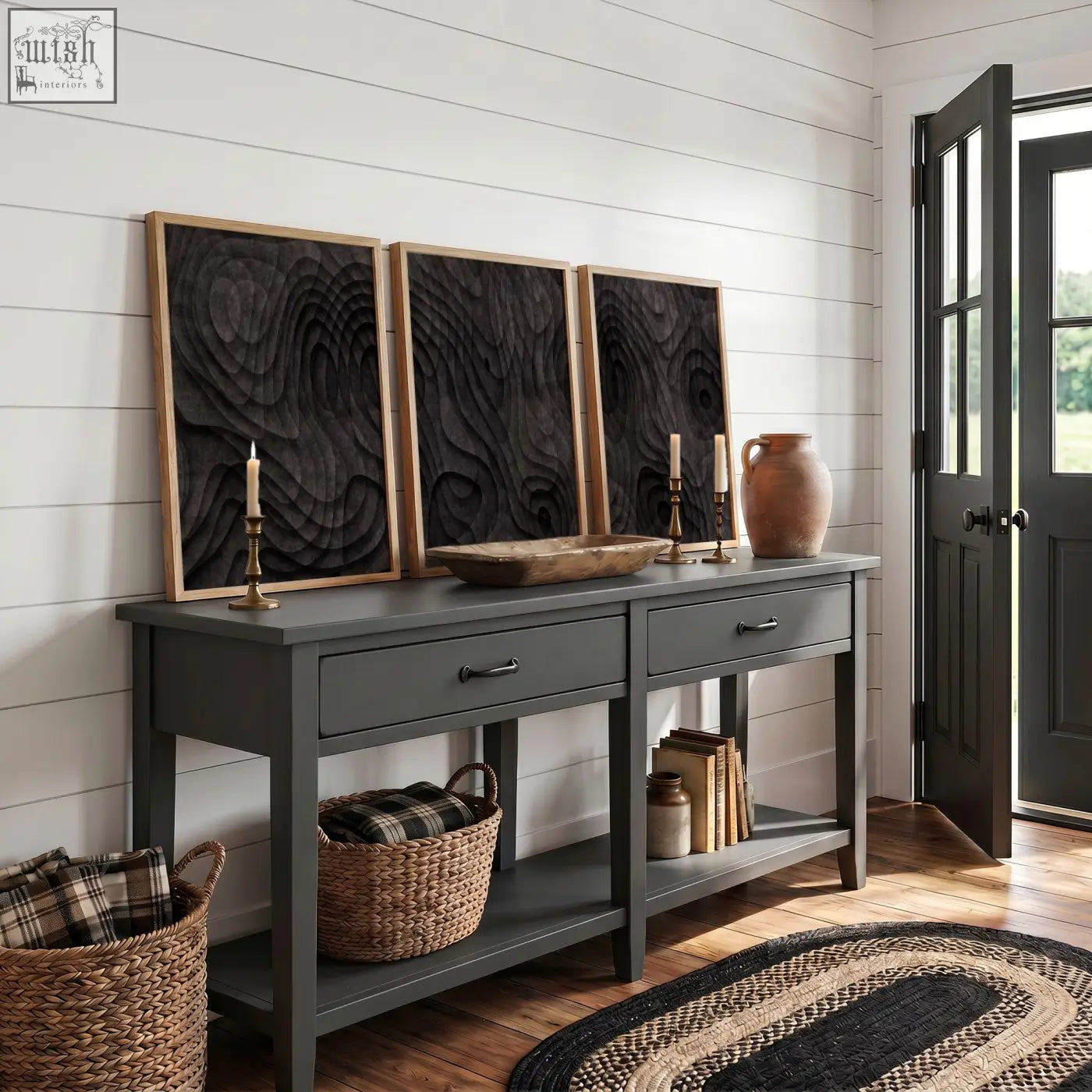 Dark gray console table with rustic wooden top and black metal handles paired with abstract dark charcoal topographic wave art