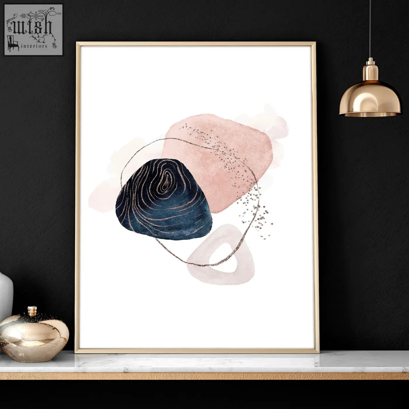 A set of 3 abstract art prints featuring soft pink and navy shapes with gold accents in slender gold frames for bedroom wall art