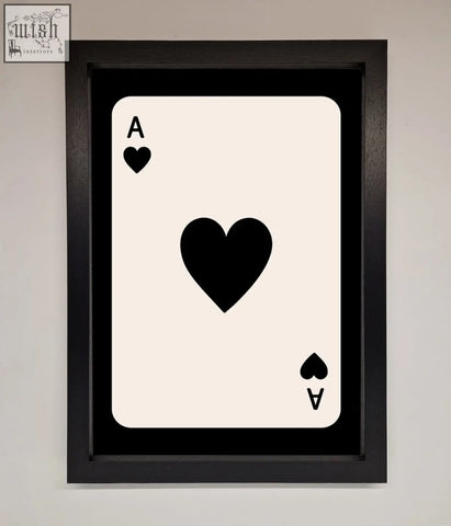 Black-framed ace of hearts framed poster with bold black heart symbols on a cream-colored background