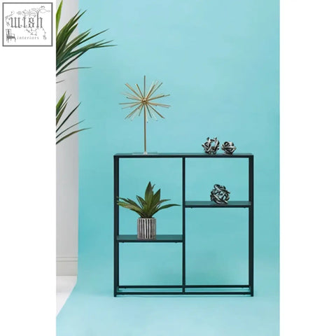 Black metal shelving unit with geometric design and multiple open compartments in acero black metal finish