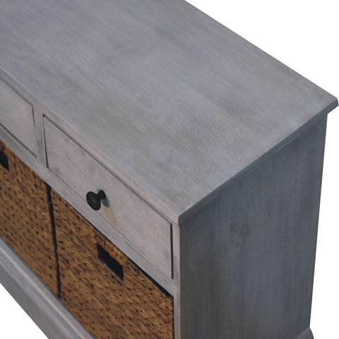 Gray acid wash wooden storage cabinet with two drawers and woven basket storage below for organized space