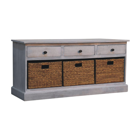 Gray acid wash wooden storage cabinet with three drawers and three wicker baskets for basket storage