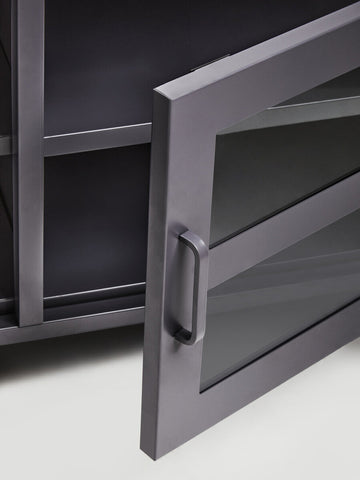 Dark grey metal media unit door with sleek minimalist handle and glass panel in acier two door grey metal media unit