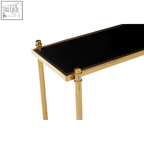 Ackley gold console table with gold finish and sleek black glass top in a minimalist rectangular design