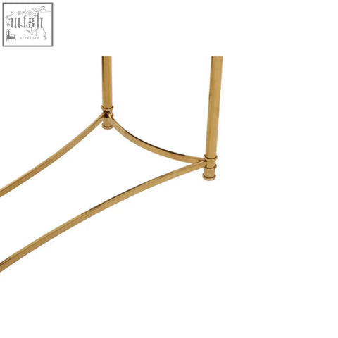 Ackley gold console table gold-toned metal leg with sleek curved design and black glass top visible