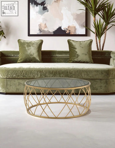 Ackley gold round coffee table with a clear glass top and geometric gold metal frame for stylish living rooms
