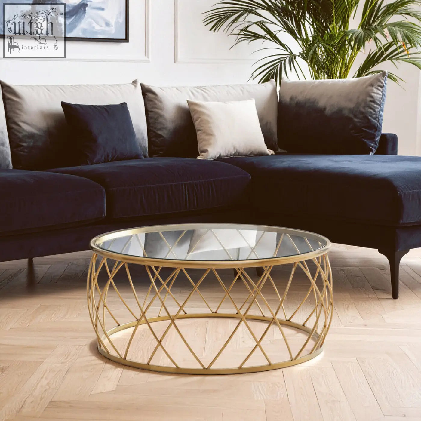 Ackley gold round coffee table with gold-toned geometric metal base and clear glass top for stylish living rooms
