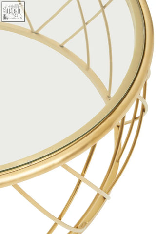Ackley gold round coffee table with gold-toned wireframe base and clear glass top perfect for modern living rooms