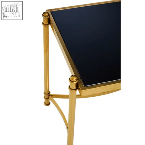 Ackley gold side table with black glass top and gold-finished stainless steel frame for stylish living spaces