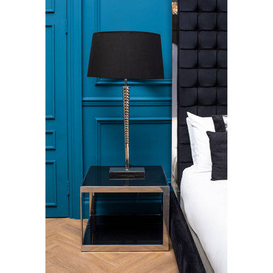 Black drum shade table lamp with metallic spiral base and mirrored glass stand on ackley silver square coffee table