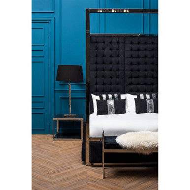 Ackley silver square coffee table with black glass and a black tufted headboard featuring a sleek metal frame
