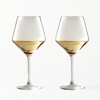 Two clear crystal burgundy glasses filled with light golden wine from the ada set of 2 crystal burgundy glasses
