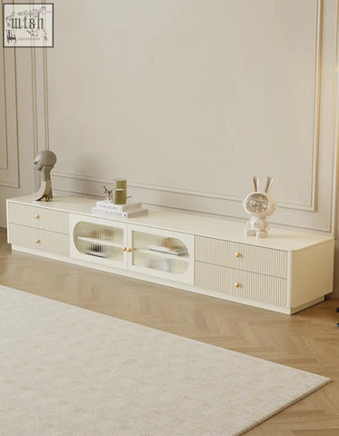 Cream-colored adelaide tv stand with vertical ribbed drawers and frosted glass panels made of pine wood