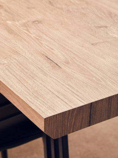 Light oak adele dining table with smooth natural grain finish and clean beveled edges for dining table use