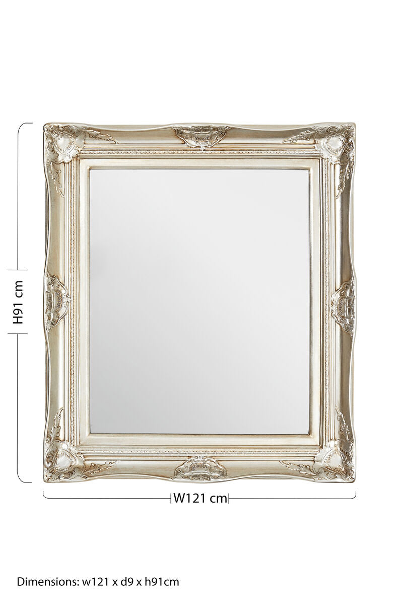 Adelere ornate metallic foliage wall mirror with a square distressed silver frame and intricate carvings