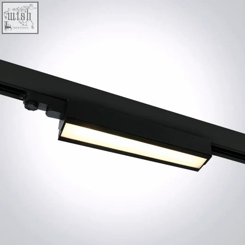 Black adjustable led linear track light with sleek rectangular design and warm white led illumination