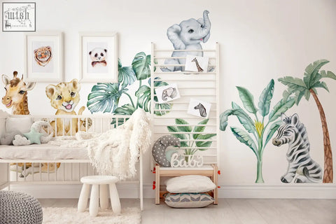 A white wooden crib with a soft blanket next to adorable safari wall decals and african animals stickers for kids room