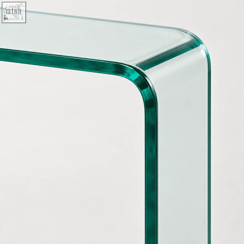 Adrienne 80cm clear glass console table with sleek transparent green tinted glass and curved waterfall design