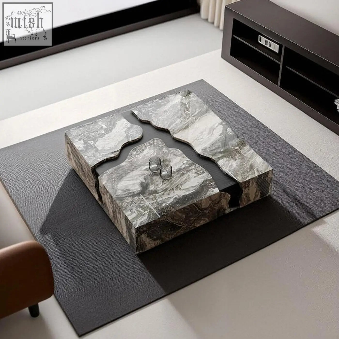 Aesop low coffee table with a sleek gray marble coffee table top featuring natural veining and a black channel