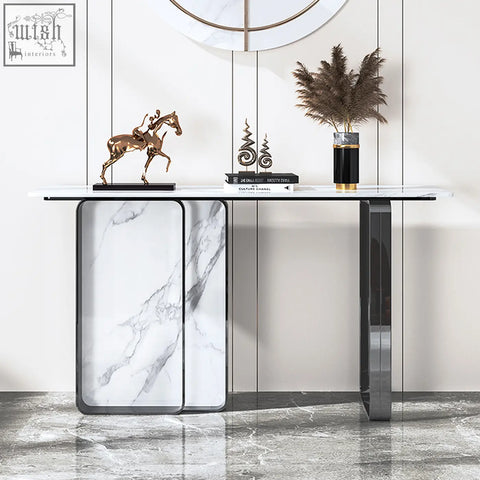 Modern aeta console table with sleek white stone top and black metal frame featuring curved side panels