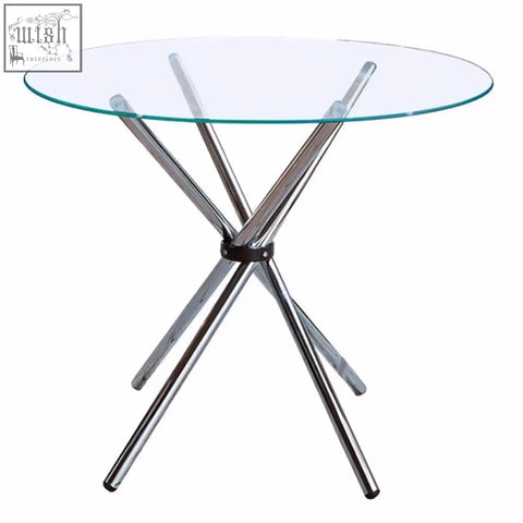 Afton round dining table with clear glass top and four angular chrome legs in a stylish cross base design