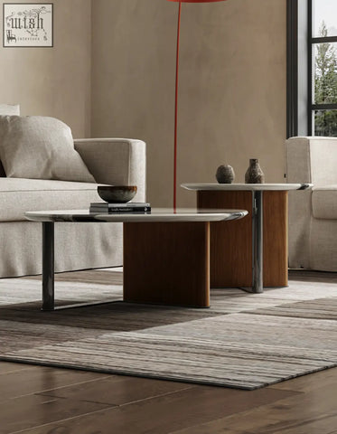 Modern agatha nesting coffee table with sleek oval glass top and dark wood base perfect for stylish living rooms