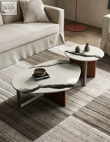 Modern oval agatha nesting coffee table with white marble top black veining sleek metal legs and wooden bases