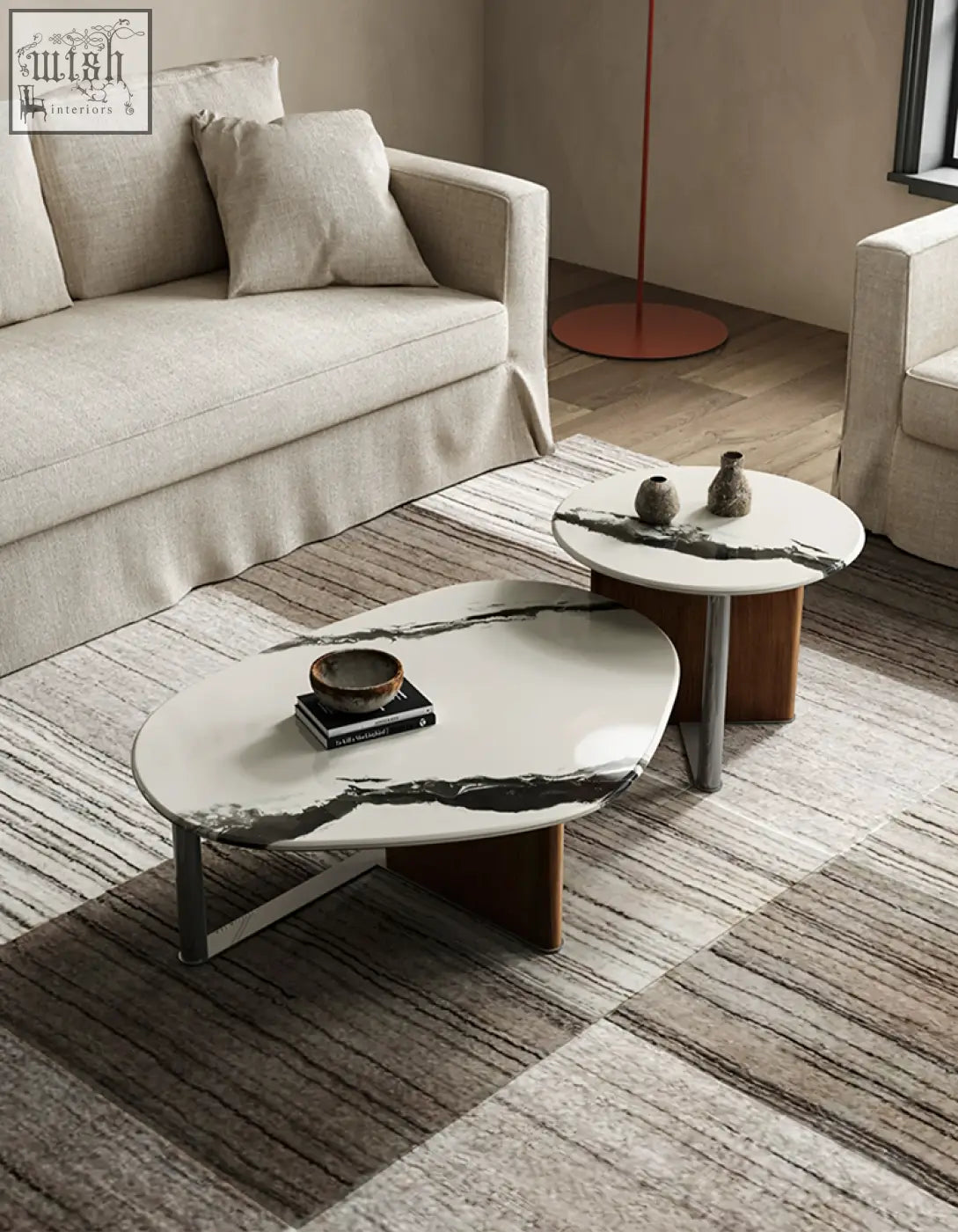 Modern agatha nesting coffee table with white marble top featuring black veining and wooden legs
