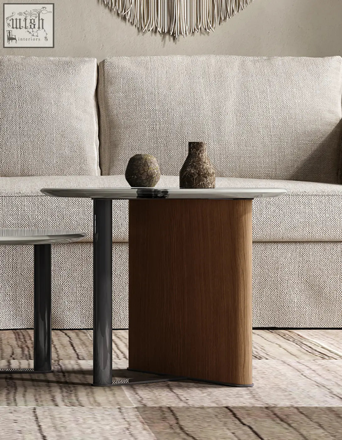 Modern agatha nesting coffee table with curved wooden base dark gray stone top and matte black metal legs