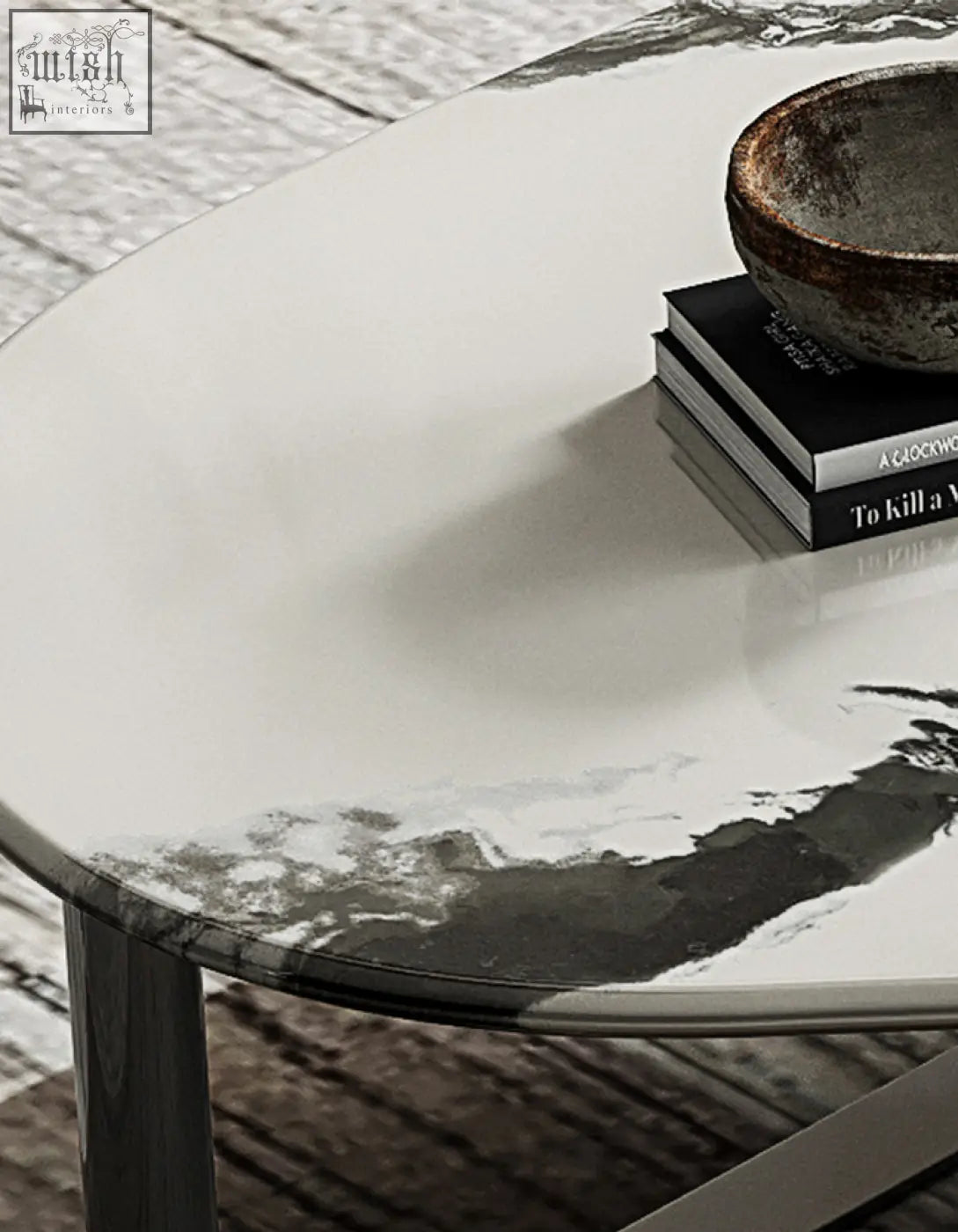 A sleek agatha nesting coffee table with a glossy white oval top featuring a black and gray marble pattern