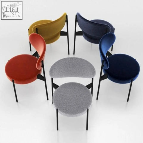 Modern ahmed dining chairs with velvet upholstery curved backrests and round seats in red yellow blue and gray colors