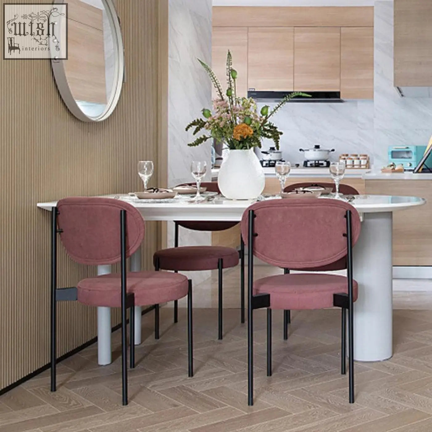 Modern blush pink velvet ahmed dining chair with sleek black metal frame perfect for stylish dining areas