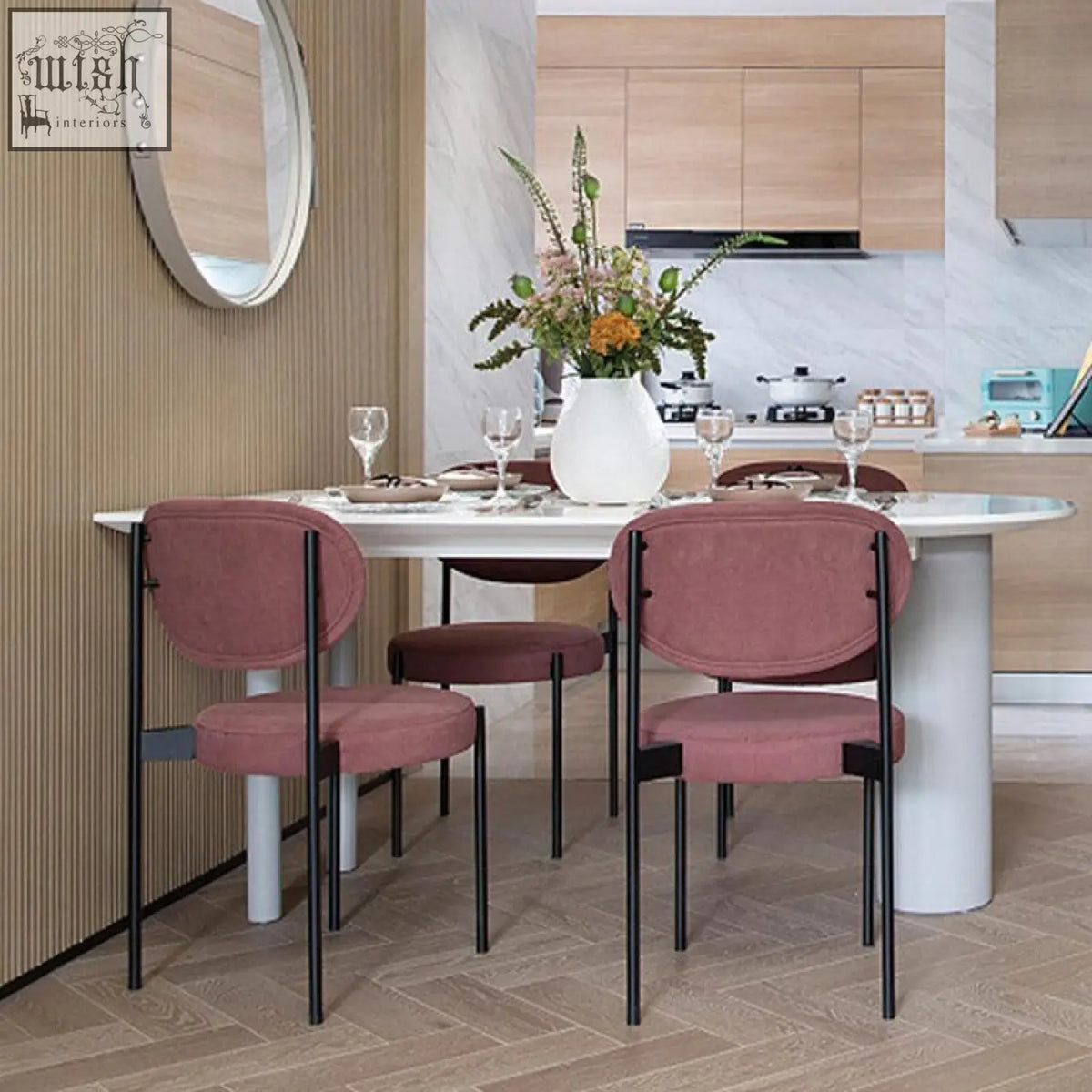 Modern blush pink velvet ahmed dining chair with sleek black metal frame perfect for stylish dining areas