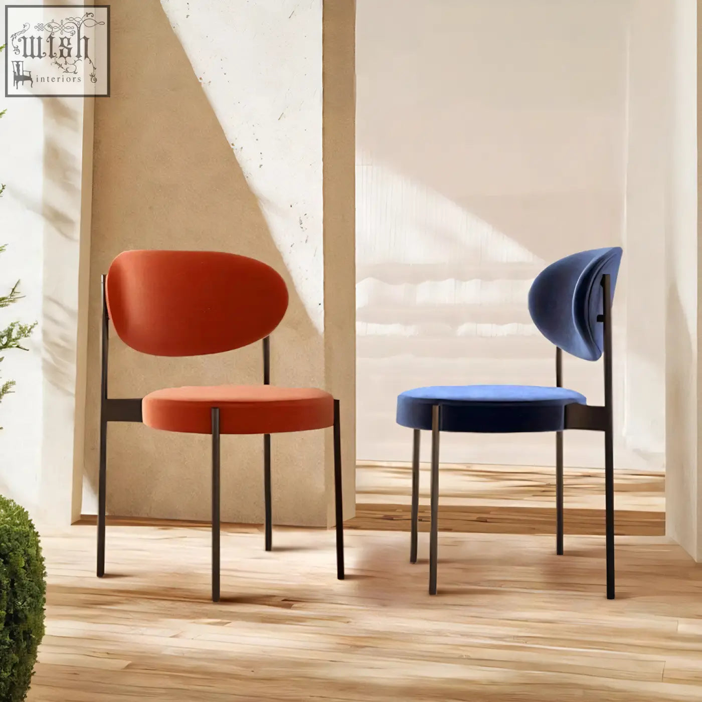 Modern minimalist ahmed dining chairs with vibrant orange and navy blue velvet on sleek black metal frames