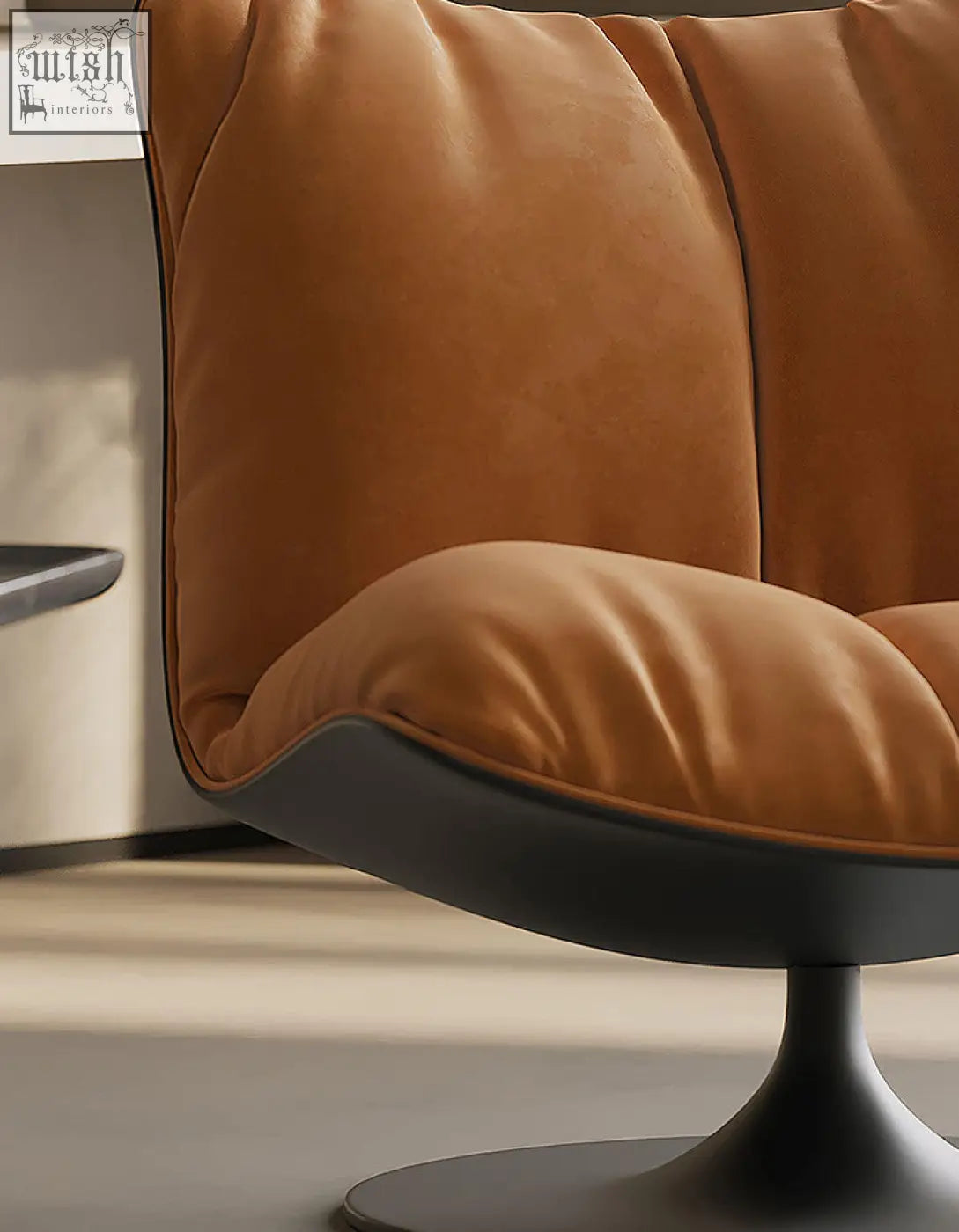 A plush caramel velvet swivel lounge chair with a sleek black pedestal base perfect for relaxing spaces