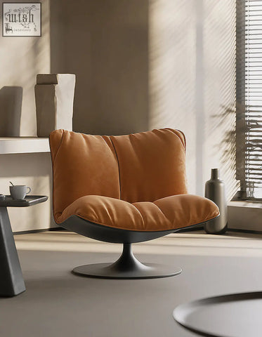 Warm orange suede ahn swivel lounge chair with velvet upholstery and sleek black pedestal base