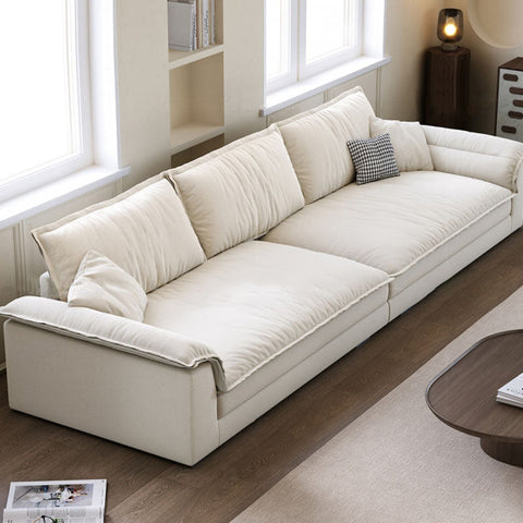 Cream-colored aiden sailboat two suede sectional sofa with plush cushioned seating and minimalist design