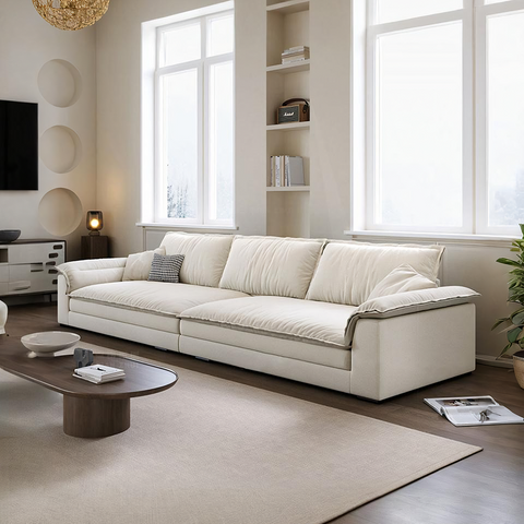 Cream-colored leather aiden sailboat two seater sofa with modern lines and subtle stitching details in suede
