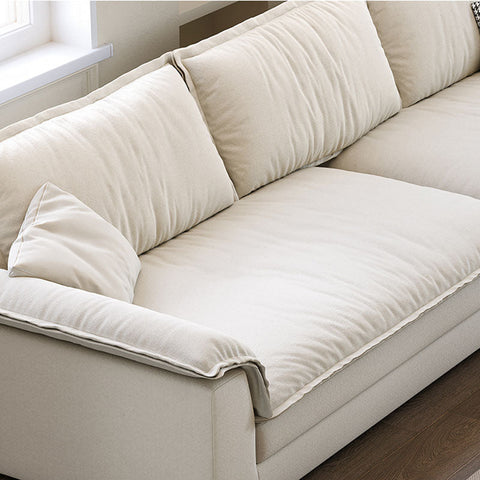 Cream-colored suede aiden sailboat two seater sofa with plush tufted cushions and clean-lined design