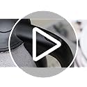 Black and white circular play button icon with stylized triangle on aigostar black glass kettle for hot water use