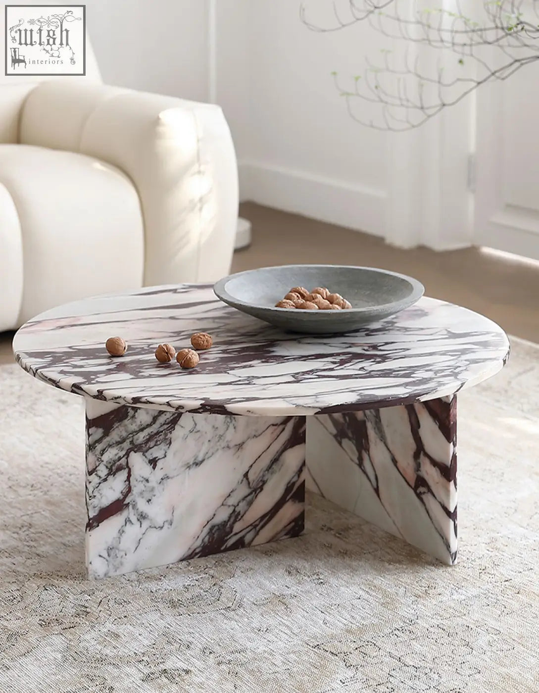 Aiko coffee table round crafted from white marble with dark veining a sleek stone coffee table perfect for any space