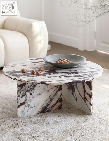 Aiko coffee table round crafted from white marble with dark veining a sleek stone coffee table perfect for any space