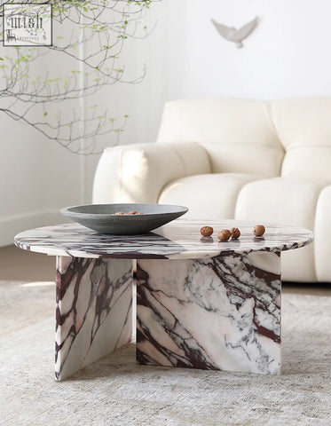 Aiko coffee table round made of white marble with dark veining a stylish stone coffee table perfect for any room
