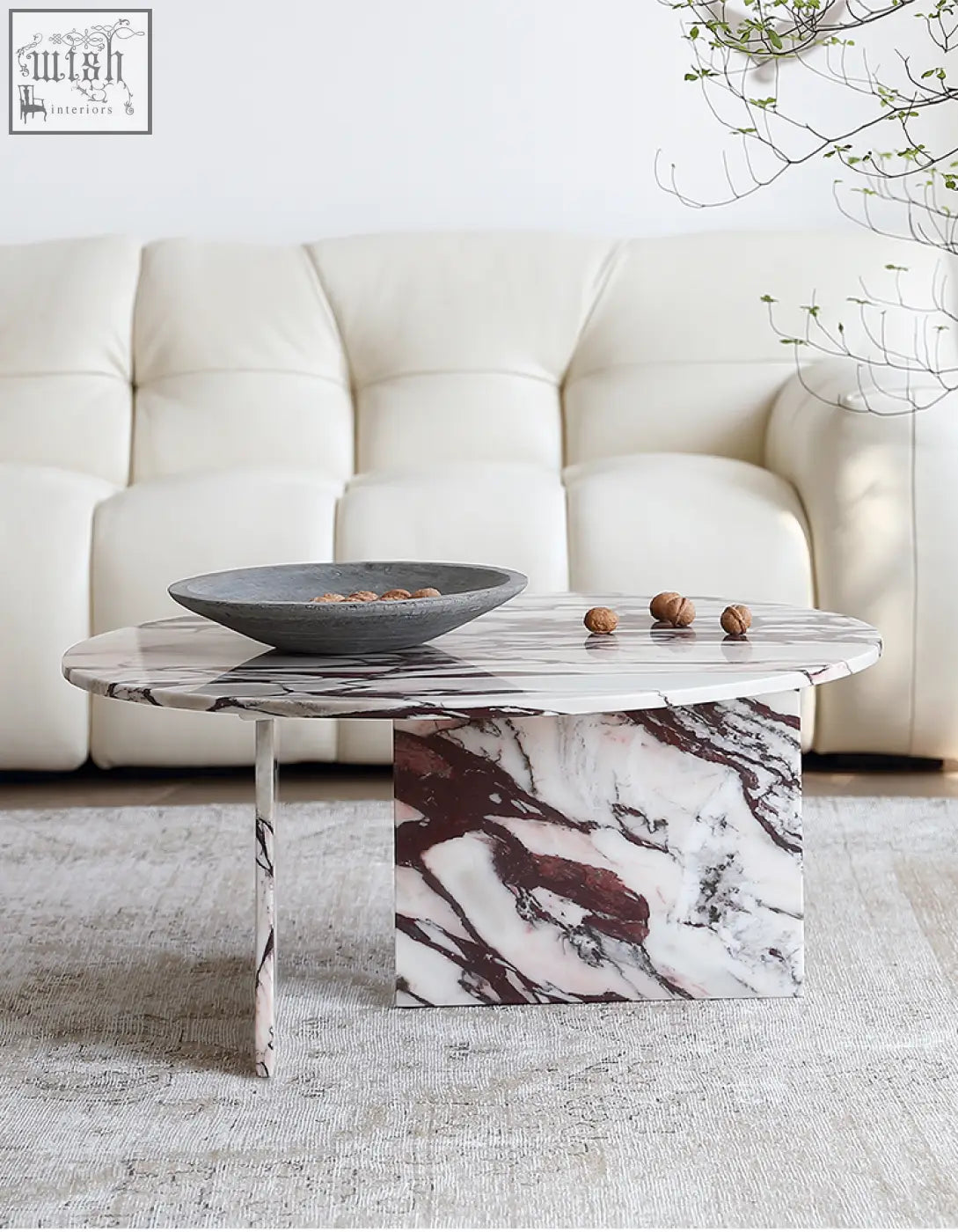 Aiko coffee table round marble with a sleek oval white and burgundy stone coffee table top and matching pedestal base