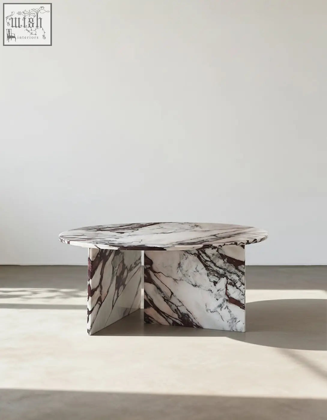 Aiko coffee table round with a sleek white and deep burgundy stone marble top and angular matching legs perfect for any space