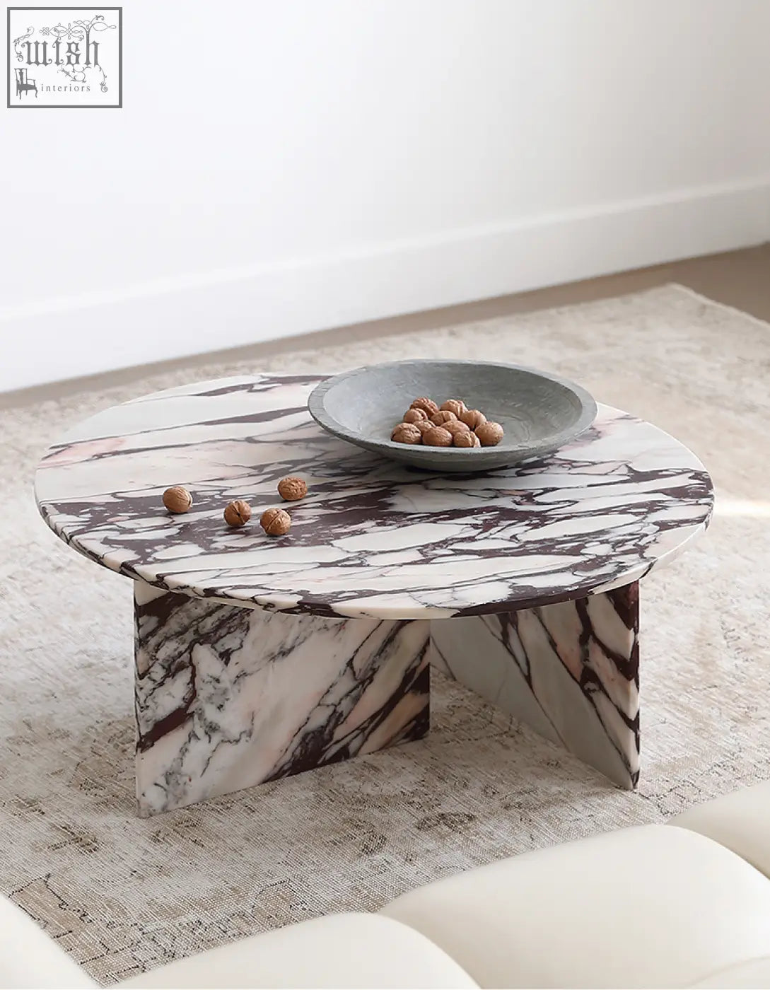 Aiko coffee table round with sleek white and dark veined stone marble top and angular legs perfect stone coffee table