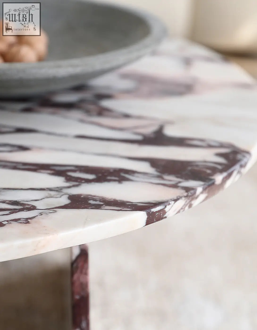 Aiko coffee table round with white and deep burgundy veined stone marble top and slender metallic legs perfect for any room