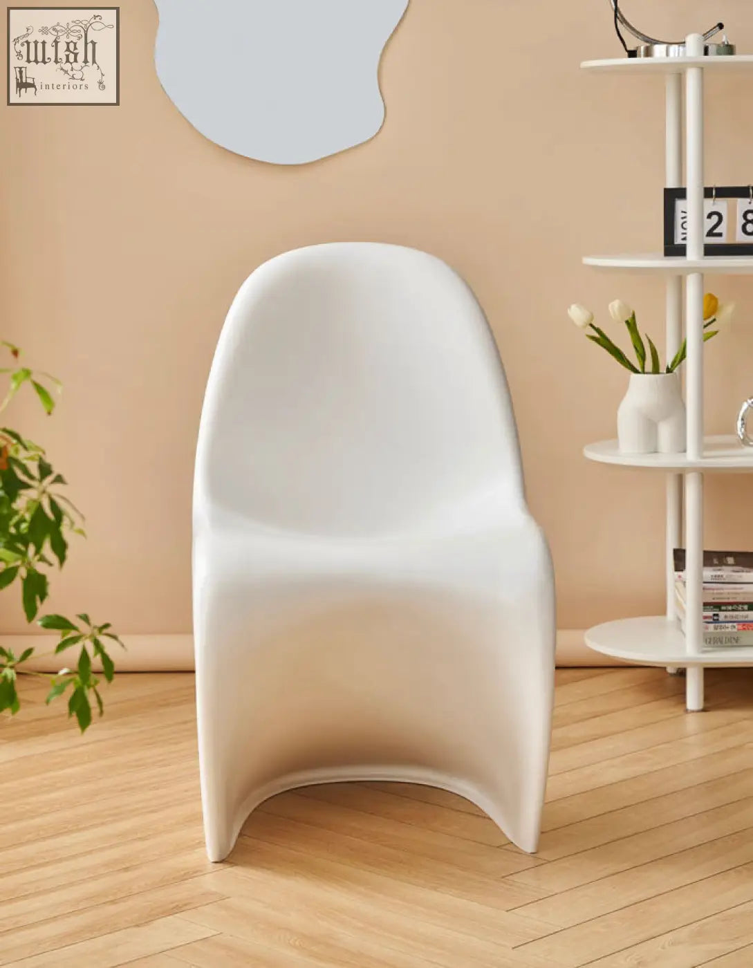 White molded plastic aimee dining chair with sleek modern design perfect for dining spaces